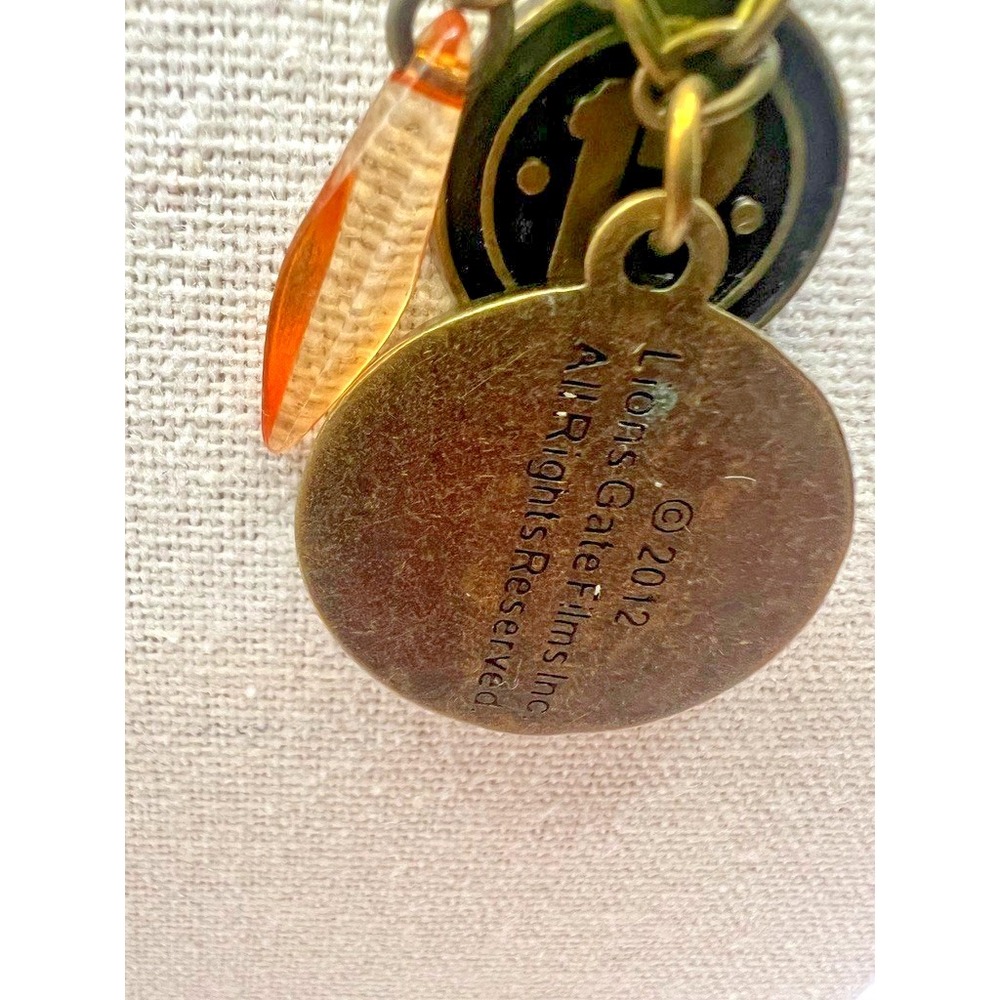 Hunger Games Necklace Peeta Medallion District 12 Official Lionsgate Official - Picture 4 of 14